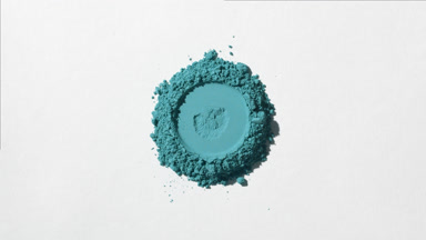 Saturated Cyan Powder with Imprint on Light Gray