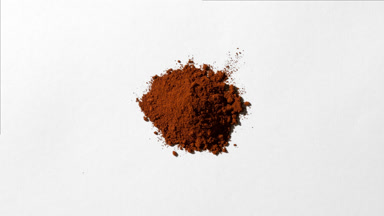 Dynamic Brown Powder Stack on Light Grey Backdrop
