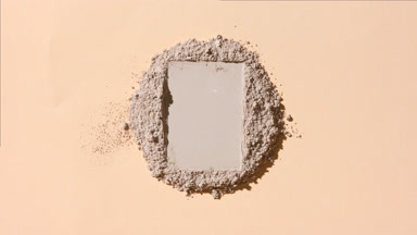 Heap of Beige Powder with Rectangular Imprint in Focus