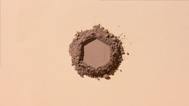 Mountain of Brown Powder with Hexagonal Engraving