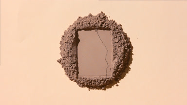 Overhead Shot of Brown Powder with Rectangular Imprint