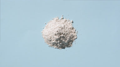 Top View of White Powder on Pale Blue Background