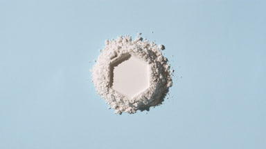 Overhead View of Hexagonal White Powder on Blue