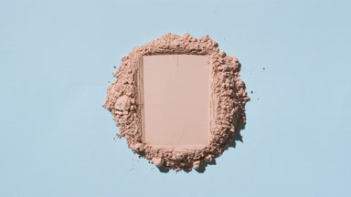 Top View of Beige Powder with Rectangular Trace on Soft Blue