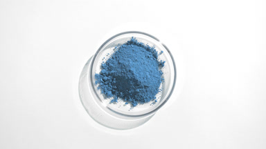 Blue Powder in Petri Dish with Dynamic Light Effects