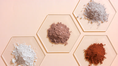 Top-Down View of Beige and Brown Powder Piles on Glass