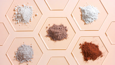 Top Perspective of Beige and Brown Powders for Foundation