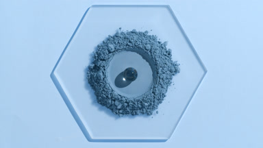 Blue Fine Powder with Hydrogel Sphere on Hexagonal Glass
