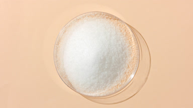 Top Perspective of White Powder in Petri Dish on Sand