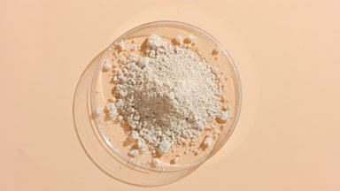 Light Beige Powder in Petri Dish with Evolving Shadows