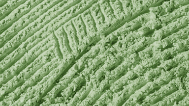 Pale Green Powder Surface with Furrows and Flowing Shadows
