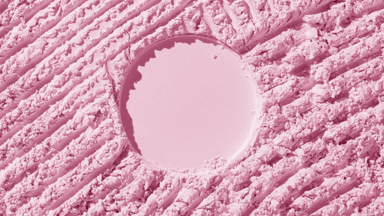 Pastel Pink Powder Surface for Blush Cosmetic Concept