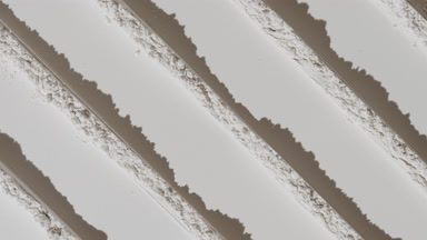 Shifting Shadows on White Powder with Knife Trail Patterns
