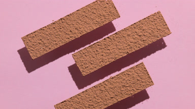 Brown Powder Stripes on Pastel Pink Surface