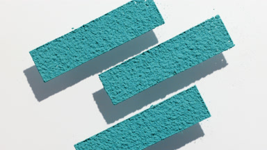 Cyan Powder Stripes on Light Grey Surface