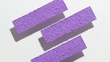 Violet Powder Stripes on Light Gray Surface