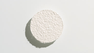 White Powder Circle on Light Grey Surface
