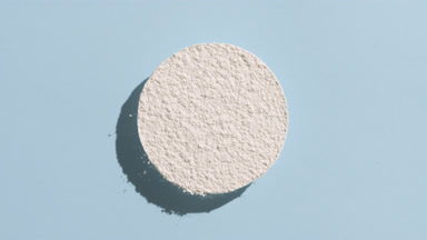 Sifted White Powder Circle on Pastel Blue for Titanium Dioxide