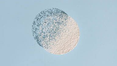 Round White Powder on Pastel Blue for Zinc Stearate