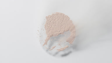 Beige Powder Blown Away on Light Grey Surface