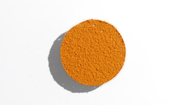 Orange Powder Sifting with Changing Shadows on White