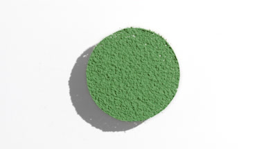 Green Powder Sifting with Flowing Shadows on White