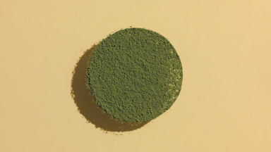 Green Fine Powder in Circular Pattern with Dynamic Shadows