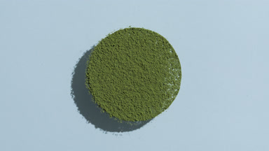 Green Powder Circle with Animated Shadow on Blue Background