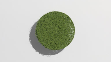 Green Powder Sifting into Circle with Shifting Shadow
