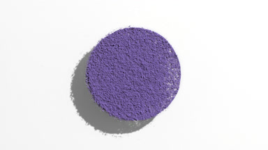 Violet Powder Circle Creating Moving Shadow Play on Grey