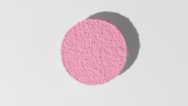 Pink Powder Circle Creating Motion Shadow on Light Grey