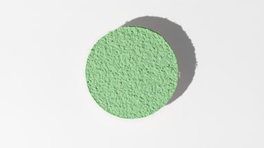 Green Sifted Powder on Gray Backdrop for Aloe Vera