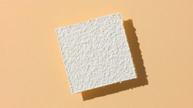 White Powder Casting Shadow on Beige for Milk Commercial