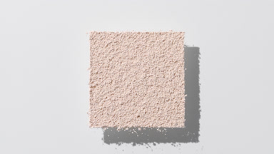 Beige Powder Casting Shadows on Muted Grey Background