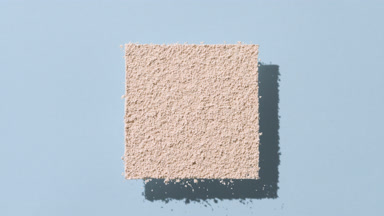 Beige Powder Creating Animated Shadows on Pastel Blue