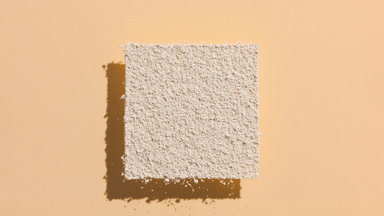 Dynamic Shadow of Beige Powder on Transparent Surface