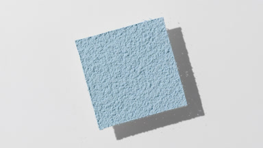 Pale Blue Powder Casting Shadows on Gentle Grey Background