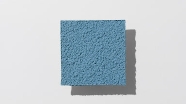 Dynamic Blue Powder Sifting on Light Grey Surface