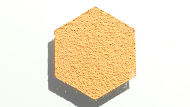 Moving Shadows of Hexagonal Yellow Powder on White