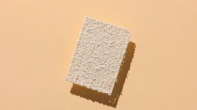 Tilted Beige Powder Shadow on Transparent Beige Surface