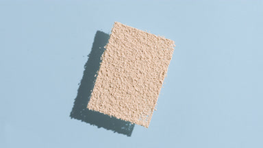 Slanted Beige Powder with Shadow on Pale Azure Background