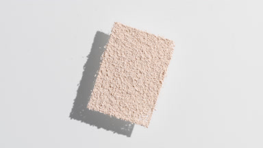 Angled Beige Powder Shadow on Muted Grey Surface