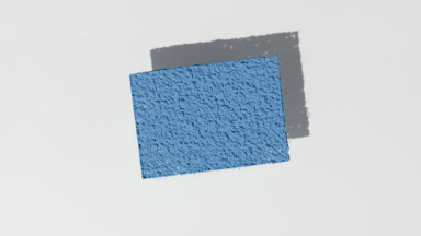 Shifting Shadows of Blue Powder on Grey Surface