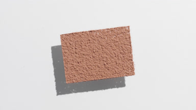 Moving Shadow Play of Brown Powder on Light Grey