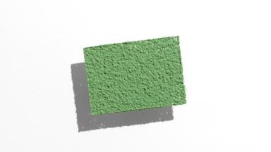 Dynamic Green Powder Shadow on White Surface