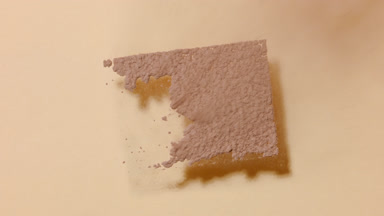 Slow-Motion Brown Powder Rectangle on Tan Backdrop