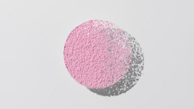 Pale Pink Powder Circle Producing Motion Shadow on Grey