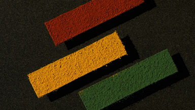 Colorful Powder Stripes on Transparent Surface over Black