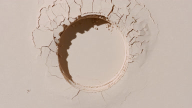 Dynamic Shadows on Beige Powder Surface with Round Imprint