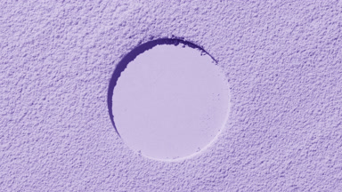 Violet Powder Surface with Circular Imprint and Shadows